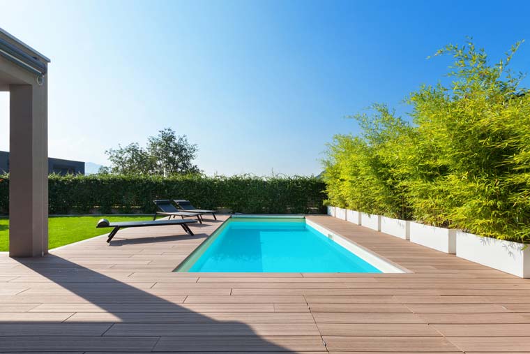 Blue Pool with brown deck— Darwin Fibreglass Pools & Spas In Winnellie, NT