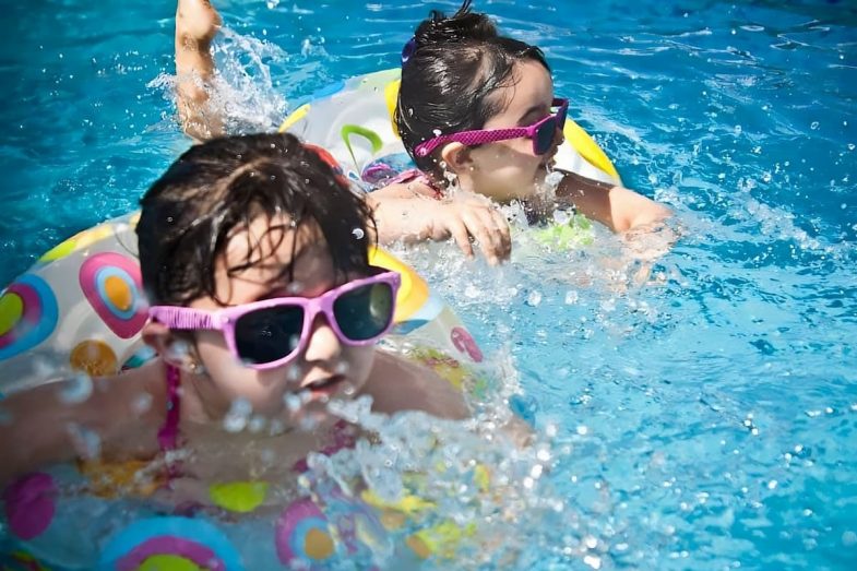Two Girls Swimming In The Pool — Darwin Fibreglass Pools & Spas In Winnellie, NT